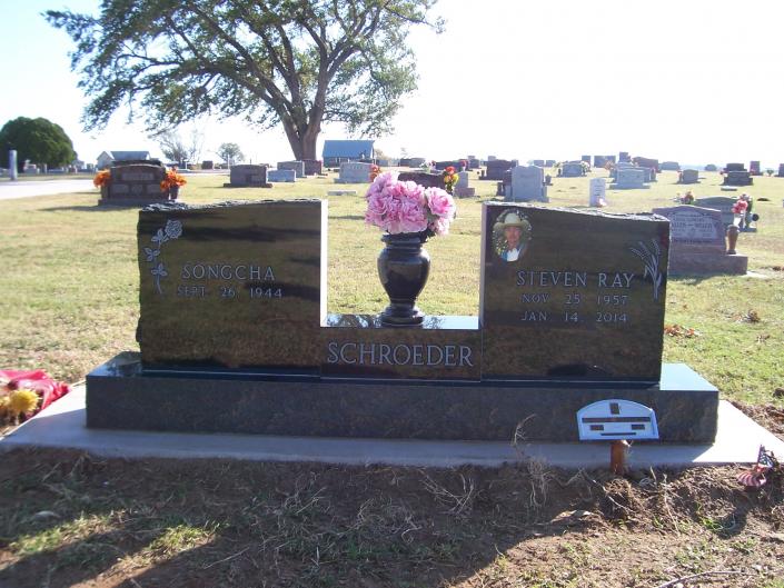 wing type monument in black, separated by all polished plinth.